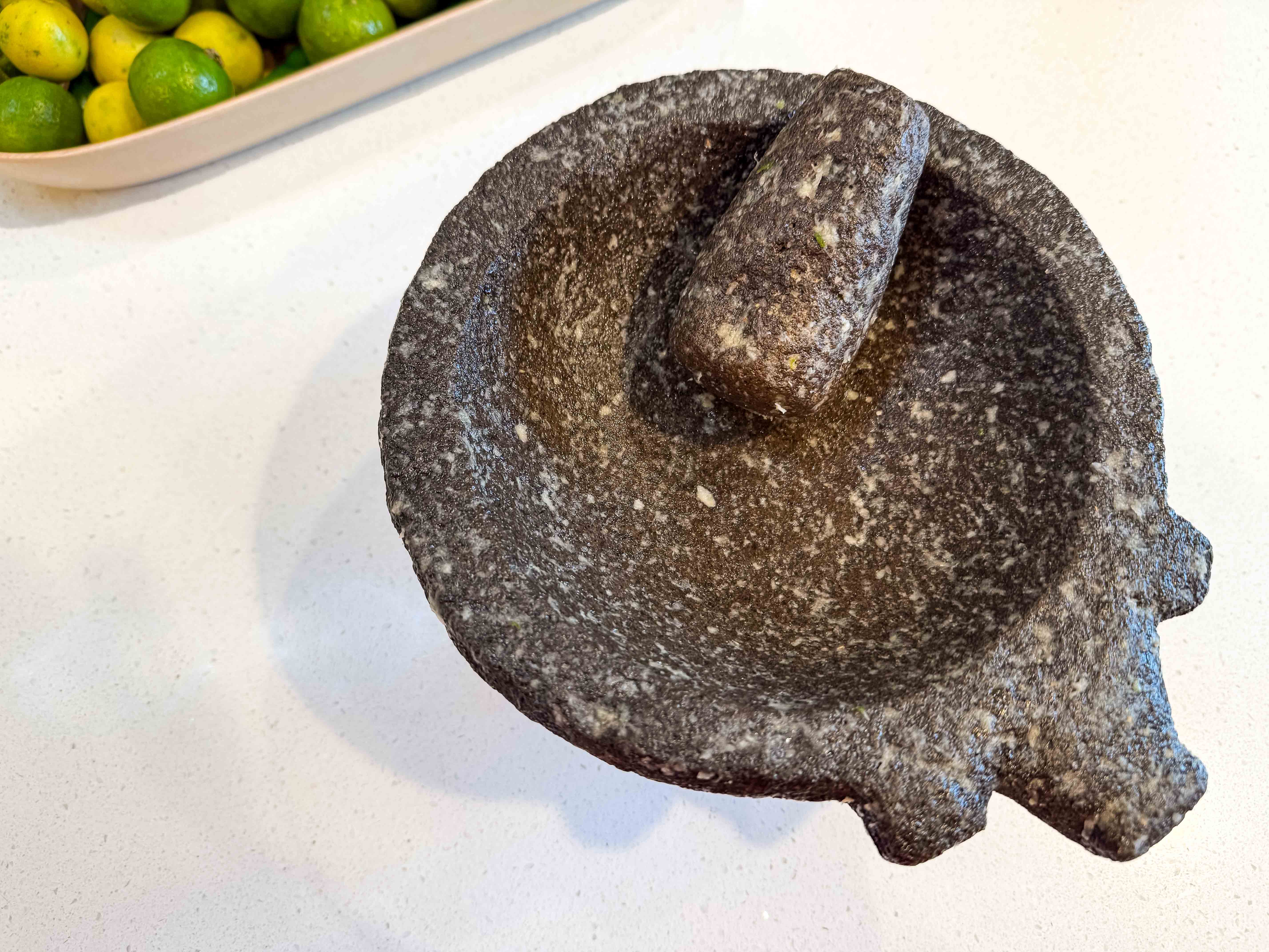 The whole molcajete and tejolote are covered in the ground salt and garlic mixture and left to sit.