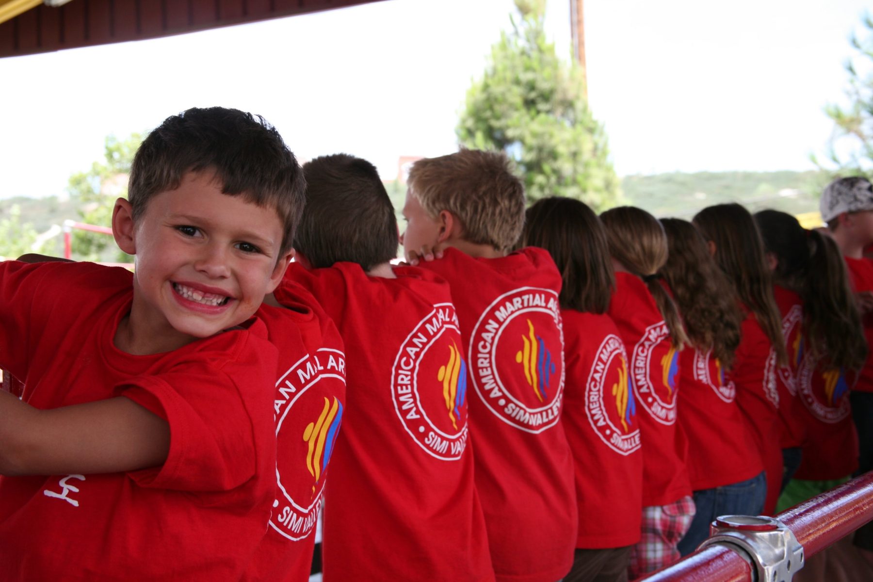Summer campers in red AMAA shirts