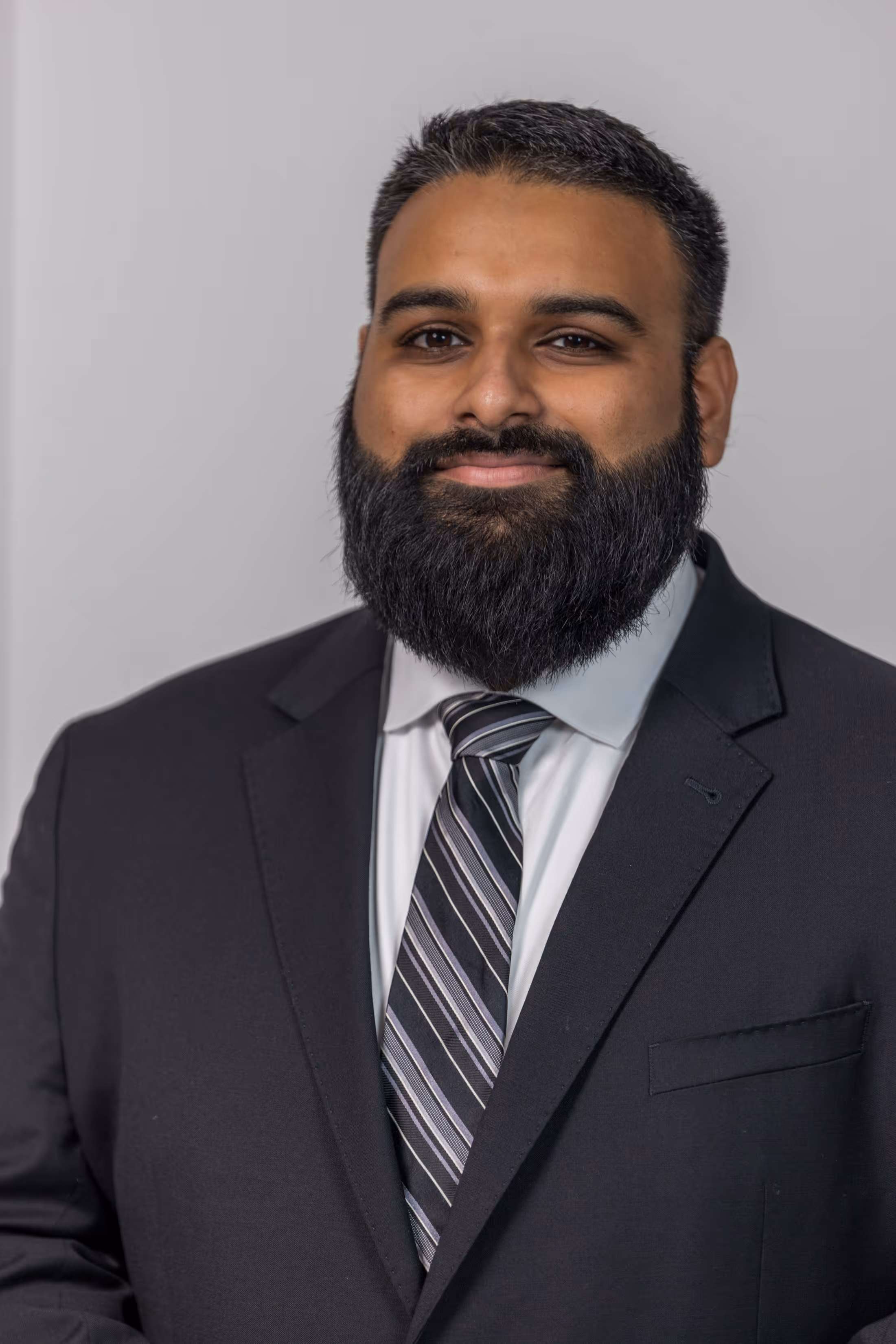 RizBiz Services founder Shaan Rizvi meeting with a small business client in Spring, TX