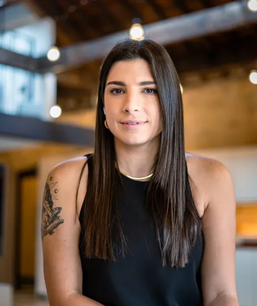 a woman in a black dress sitting down - volunteer - best organization website webflow CMS template