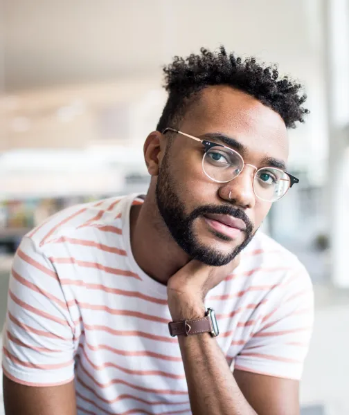 a man with a beard and glasses looking at the camera - volunteer - best organization website webflow CMS template