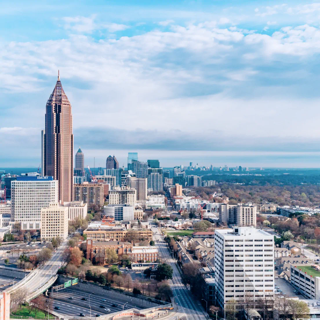 a view of a city with tall buildings - volunteer - best organization website webflow CMS template