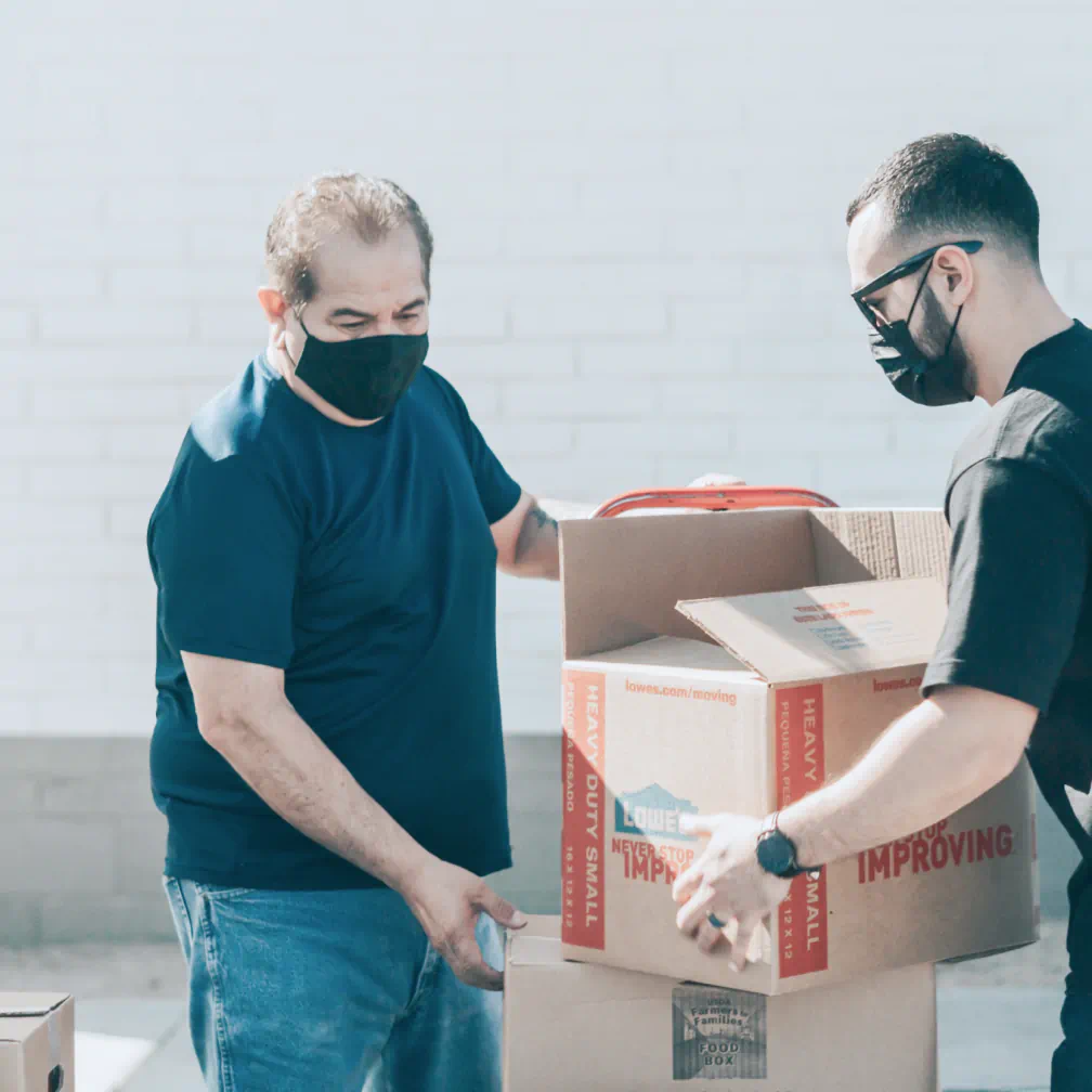 a man in a face mask and a man in a black t - volunteer - best organization website webflow CMS template