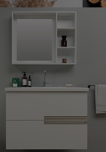 Modern bathroom vanity with mirror cabinet, faucet, soap dispenser, and towel on gray wall.
