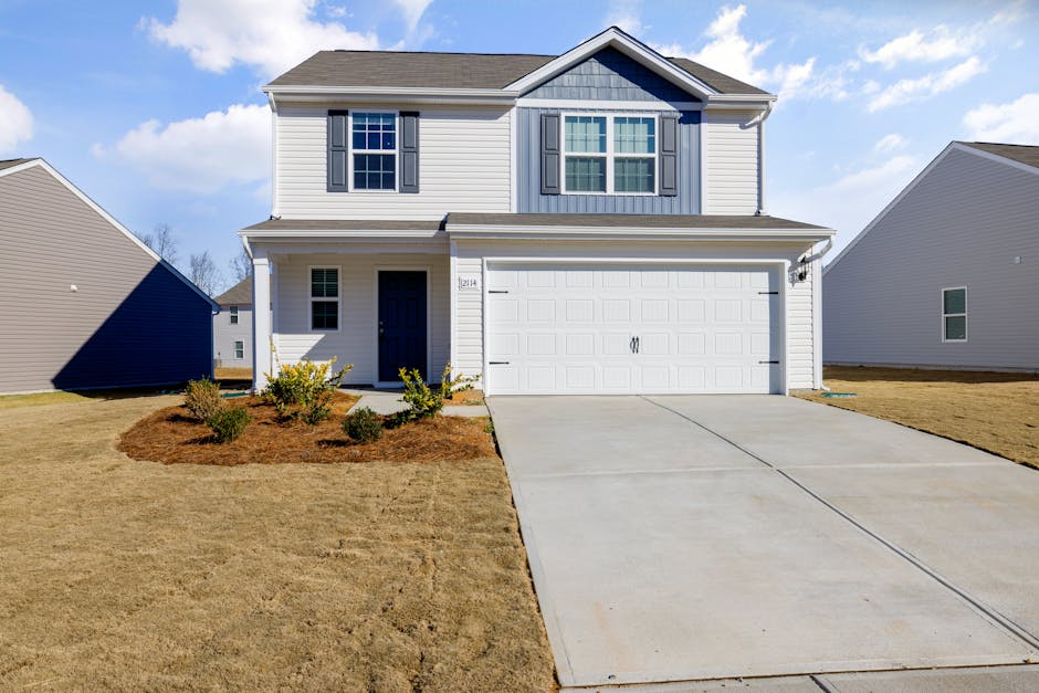 Brand new, stylish garage door installed on a suburban home - garage door repair las vegas nv