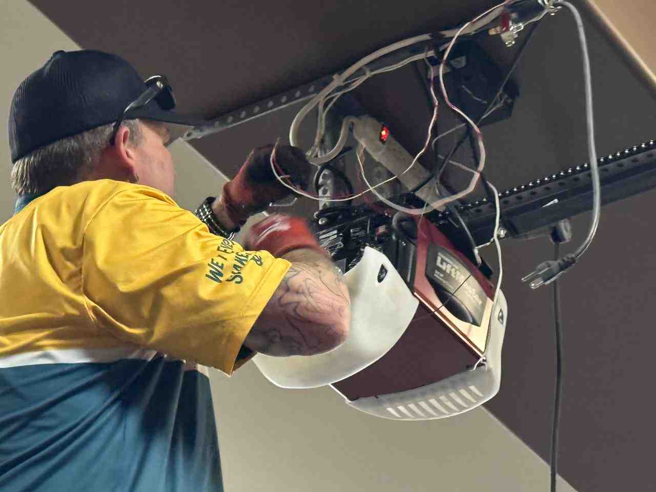Technician inspecting a stripped nylon garage door gear assembly - Same Day Garage Door Opener Gear Sprocket Repairs Las Vegas NV