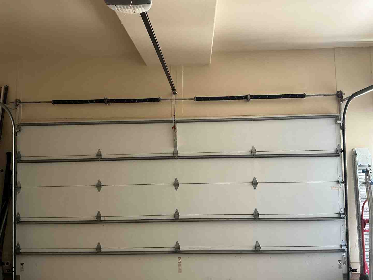 Infographic explaining the key components of a garage door system, such as springs, cables, rollers, tracks, and opener Infographic explaining the key components of a garage door system, such as springs, cables, rollers, tracks, and opener