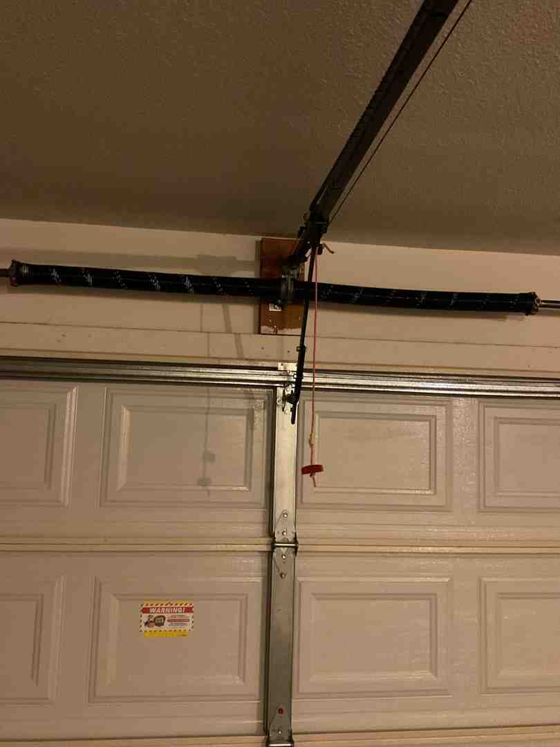 Infographic showing how garage door sensors prevent accidents: beam interruption triggers auto-reverse safety mechanism