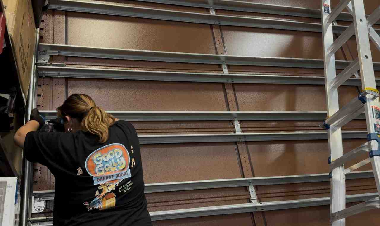 Homeowner safely inspecting a garage door - My garage door is broken and won't close. I need a fast solution in Green