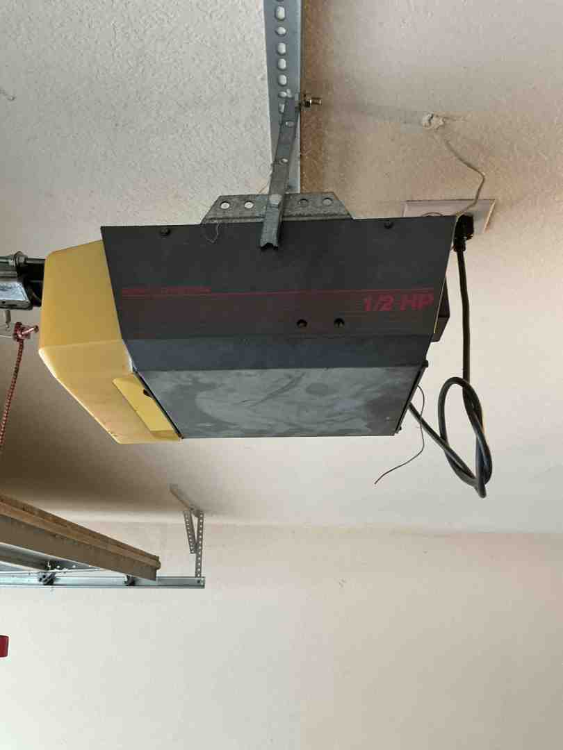 Modern garage door opener motor installed on a garage ceiling - garage door opener repair service in liberty hill tx Modern garage door opener motor installed on a garage ceiling - garage door opener repair service in liberty hill tx