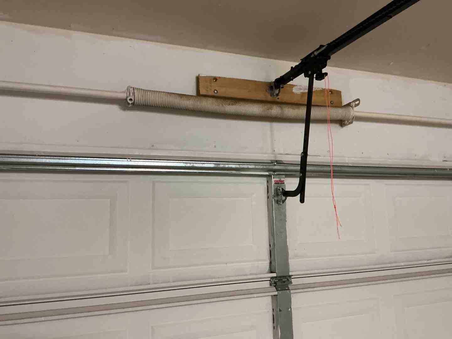 Infographic showing garage door lifespan by component: door 15-30 yrs, opener 10-15 yrs, springs 7-12 yrs - how long does a