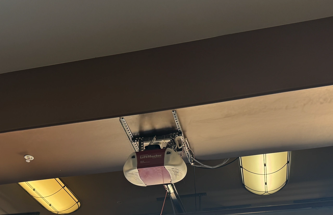 Heavy-duty garage door opener motor showing internal gear components Heavy-duty garage door opener motor showing internal gear components