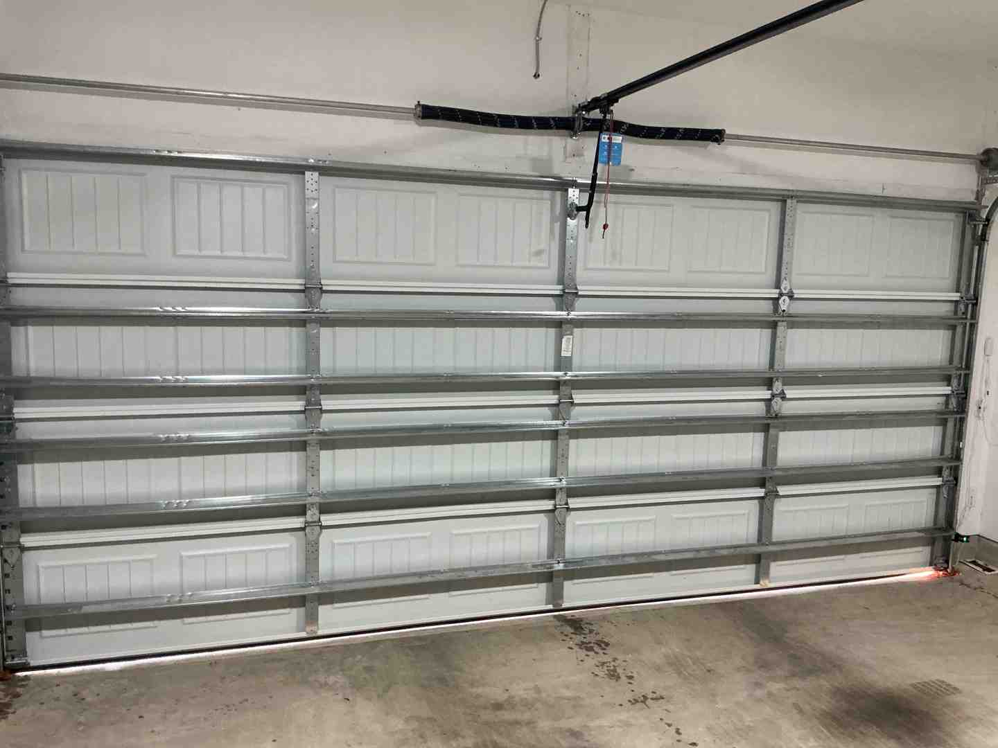 inside view of a steel garage door showing structural reinforcement struts that prevent warping inside view of a steel garage door showing structural reinforcement struts that prevent warping