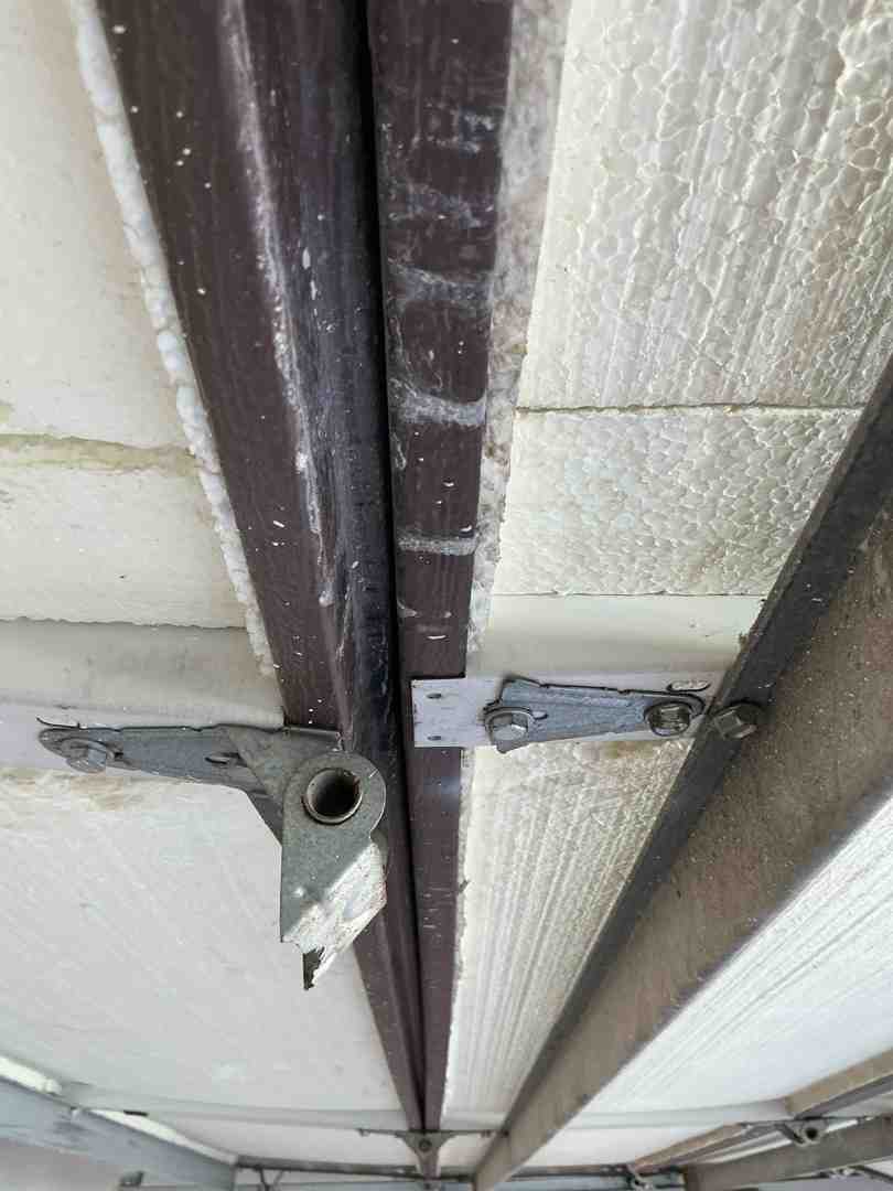 insulated garage door construction showing multi-layer steel and foam core insulated garage door construction showing multi-layer steel and foam core