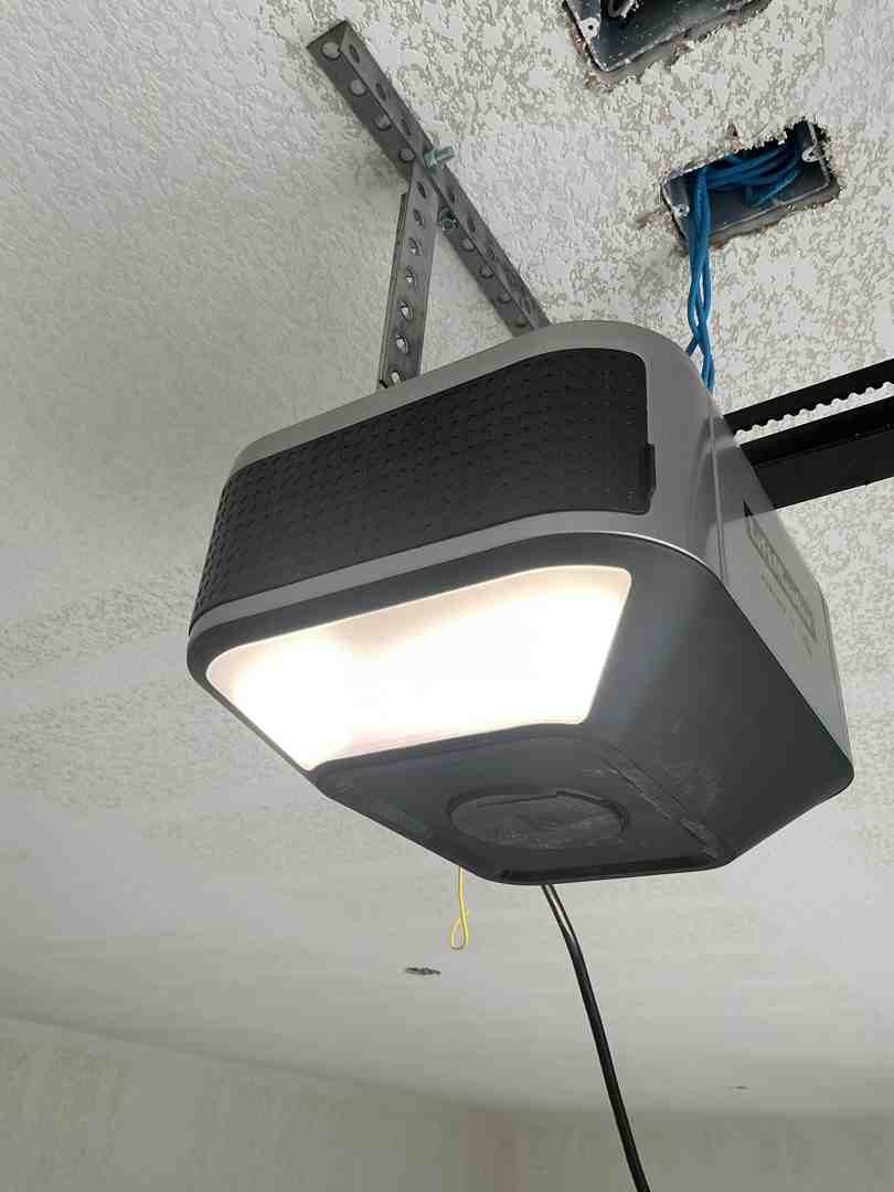 A secure garage door opener installed on the ceiling inside a garage