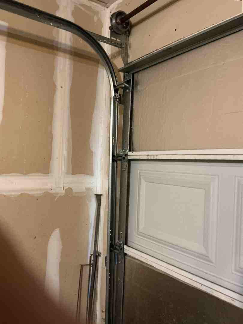 Different garage door materials showing sturdy interior tracking systems