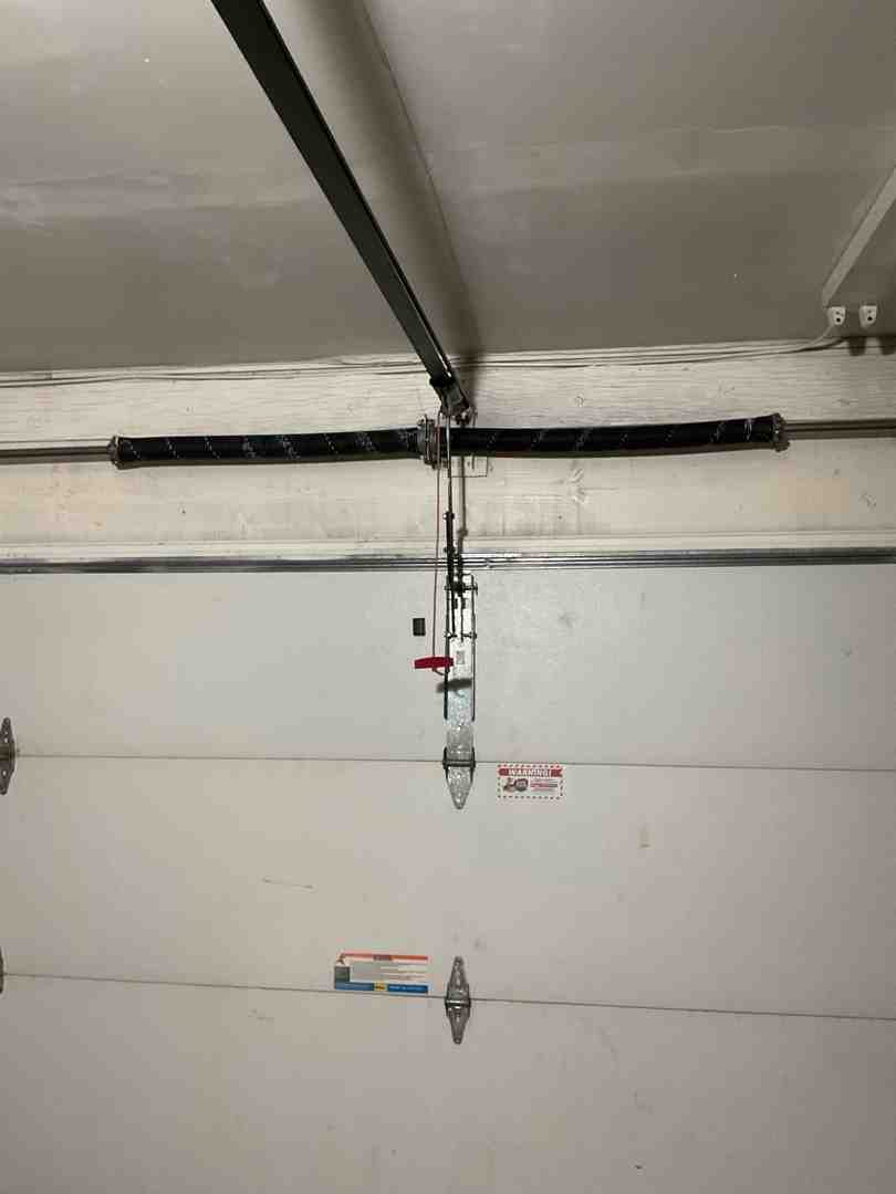 modern residential garage door system showing counterbalance parts from the inside