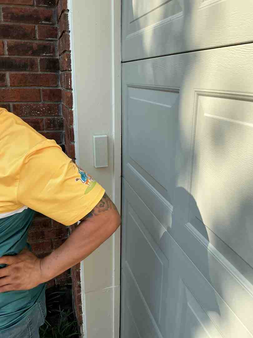 A physical garage door shield preventing external bypass attempts