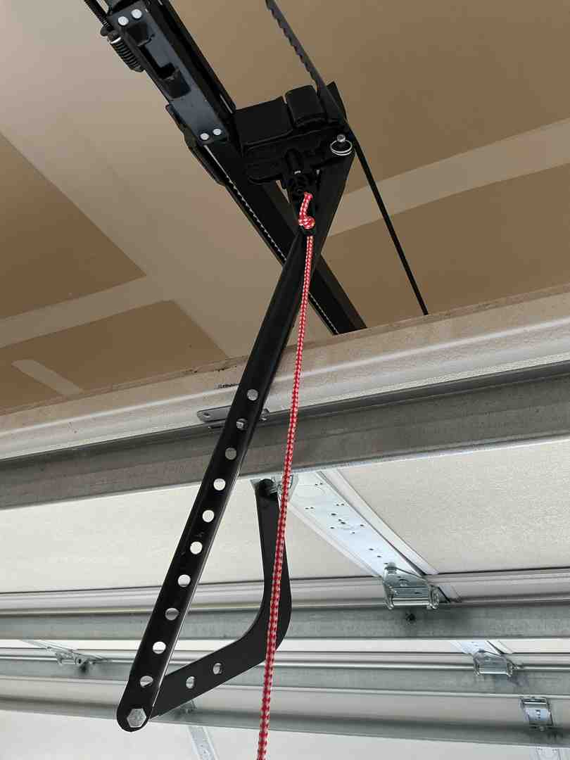 zip tie secured to a garage door emergency release lever zip tie secured to a garage door emergency release lever