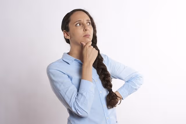 woman thinking and trying to decide between garage door repair and garage door replacement in Las Vegas