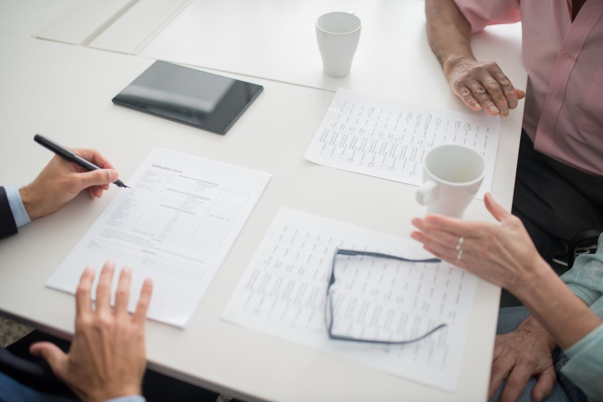 Application form and paperwork on a bright office table