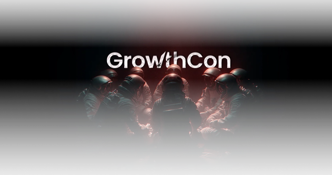 Group of astronauts sitting in a circle with the word GrowthCon above them on a dark background.