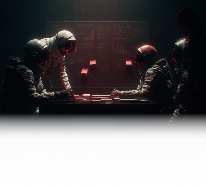 Four astronauts in space suits sitting and standing around a table with papers and sticky notes, illuminated in a dark room with a large screen displaying charts and graphs in the background.