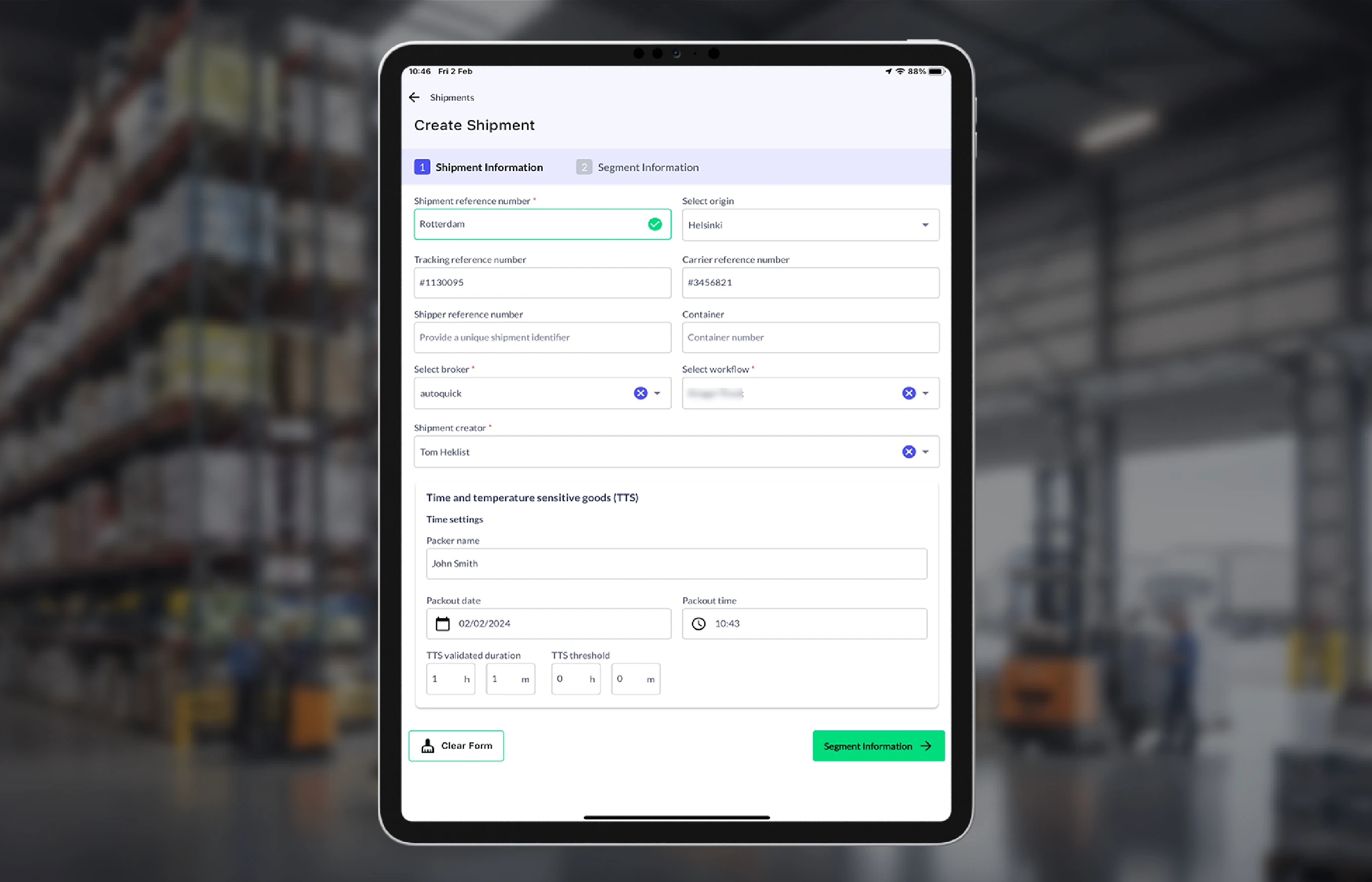 Tablet displaying a shipment creation form with fields for shipment reference number, origin, tracking numbers, broker, workflow, shipment creator, and time and temperature sensitive goods settings.