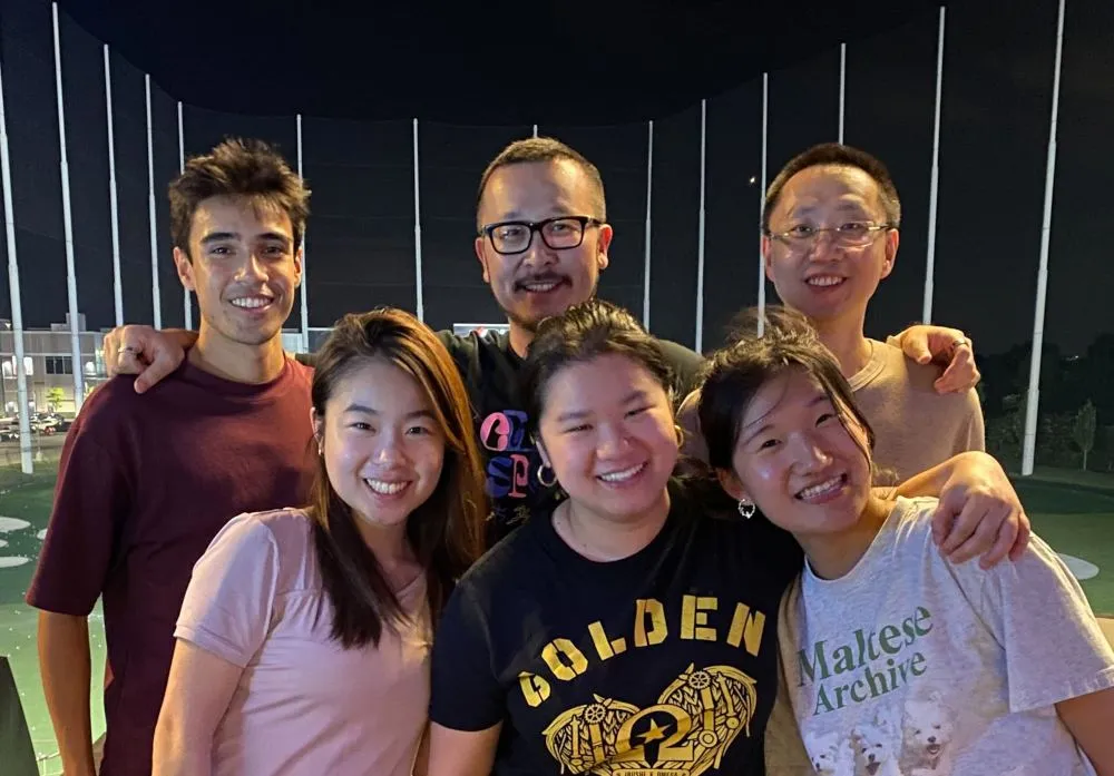 A group of people standing next to each other