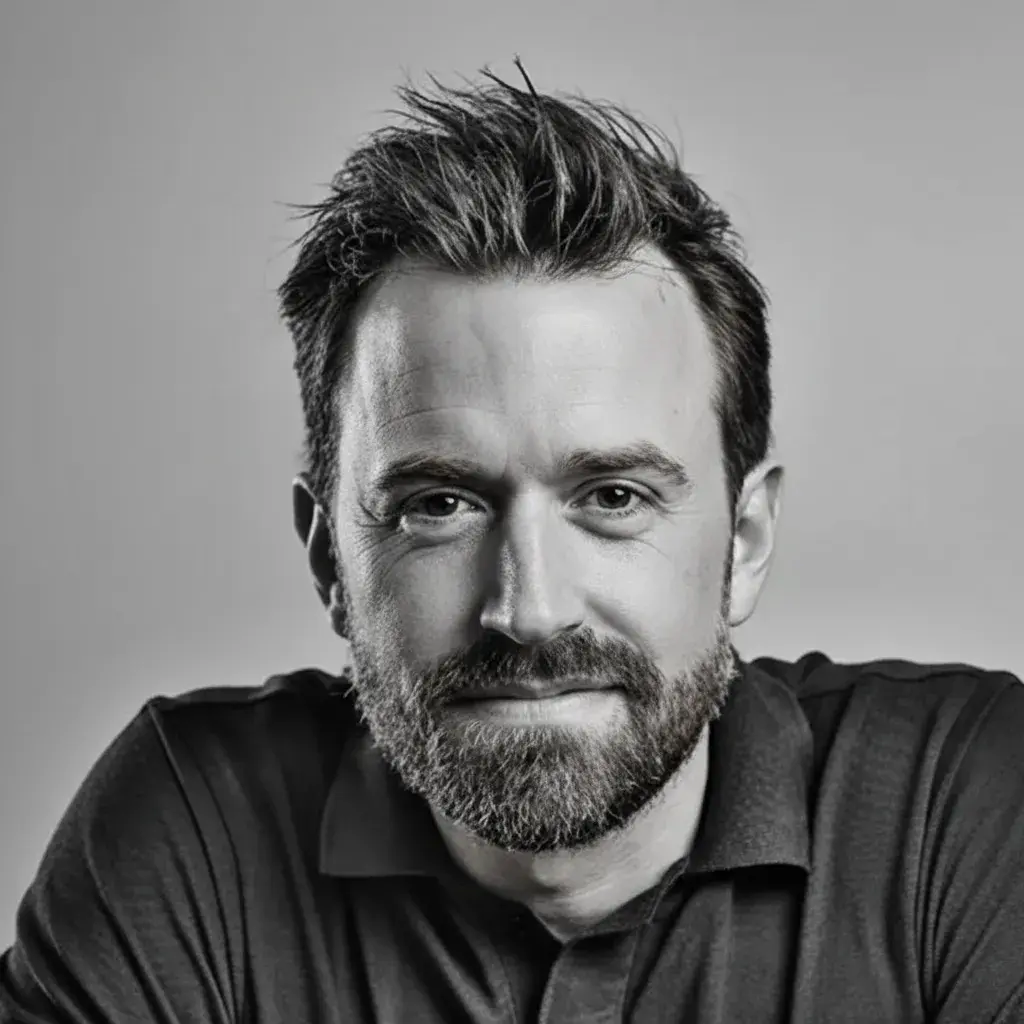 A man with a beard and a black shirt