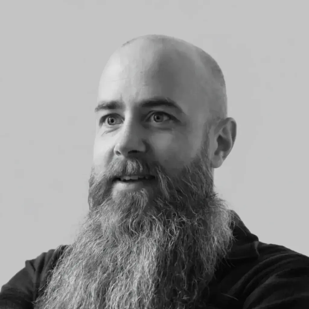 A man with a long beard and a bald head