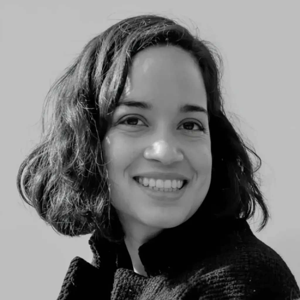 A black and white photo of a woman smiling