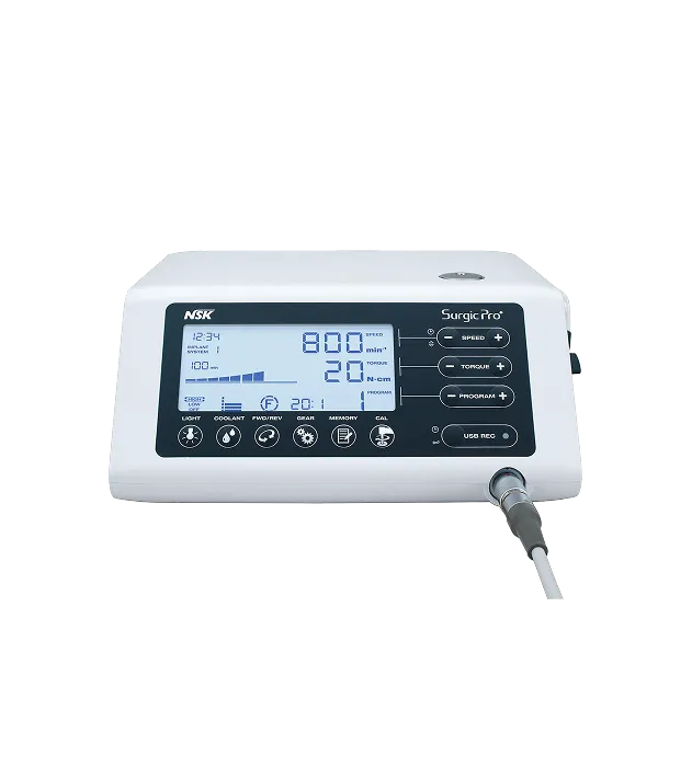 Surgic Pro dental device control panel with digital display showing speed and torque settings and multiple buttons for adjustment.