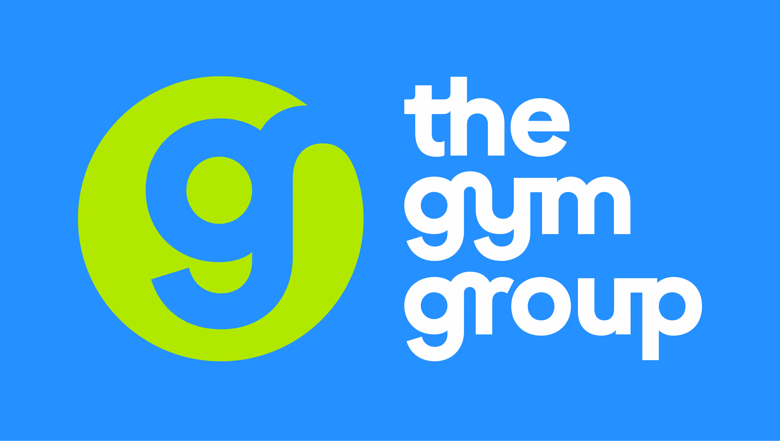 The Gym Group logo with a lime green lowercase g inside a circle and white text on a blue background.