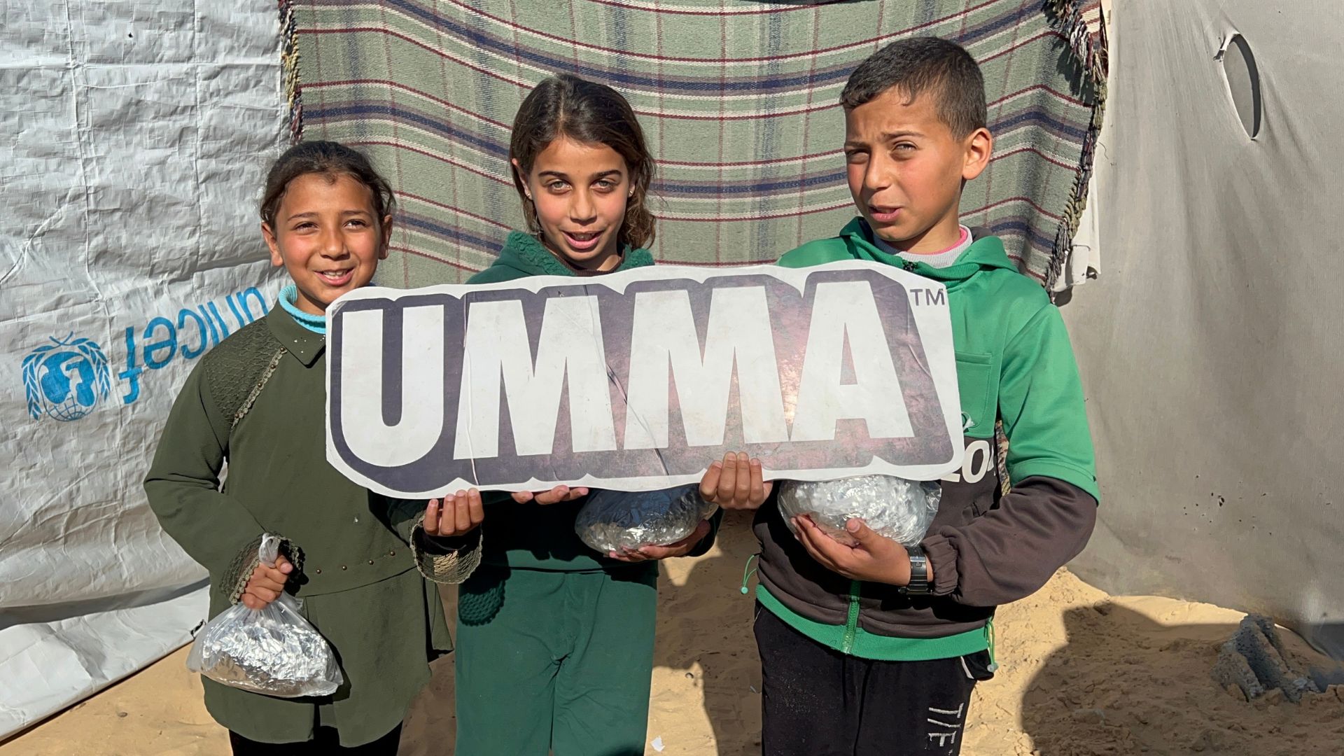 Kids holding Umma banner.