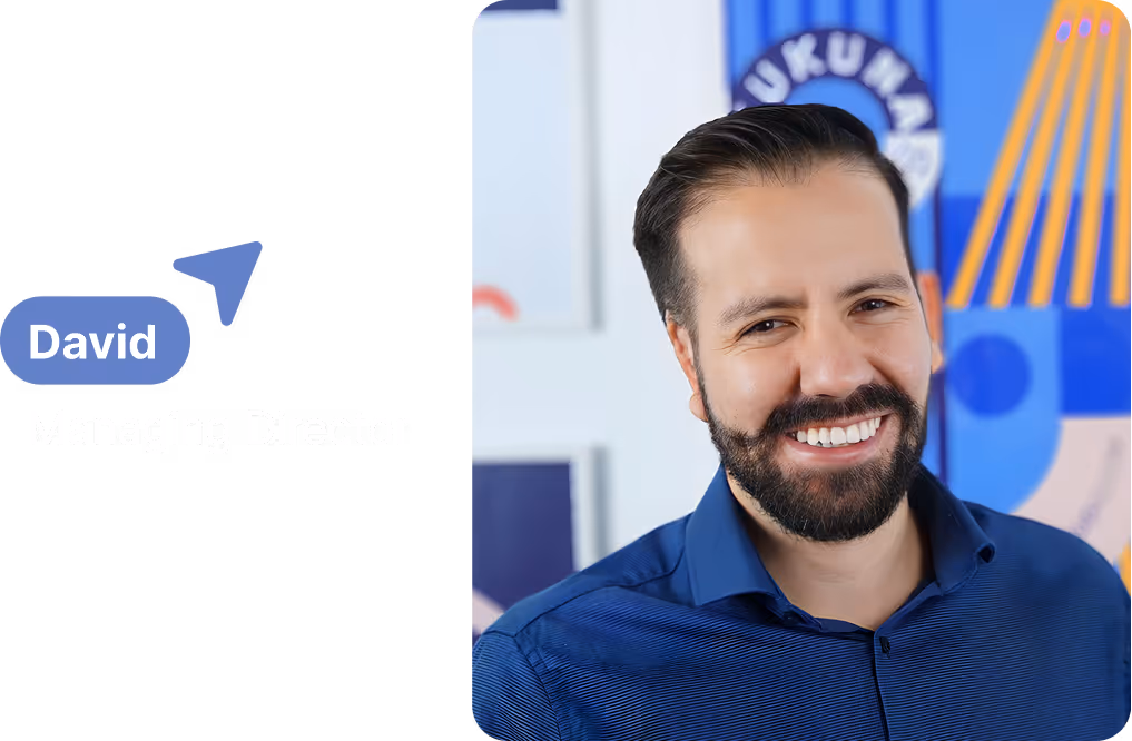 Portrait of David, Managing Director at Tukuna Studio, smiling in a blue shirt.