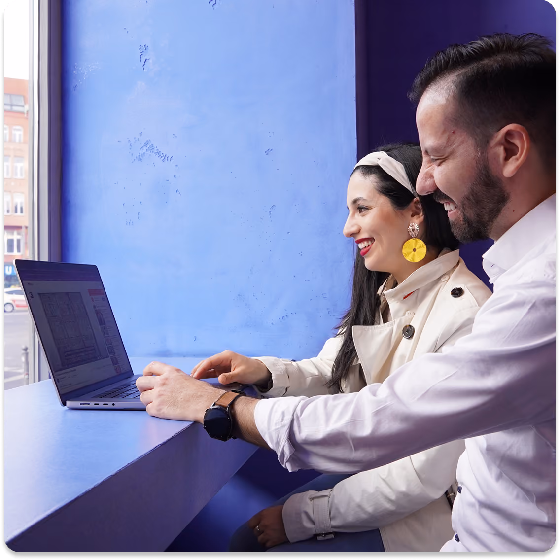 Video call screen showing four diverse professionals smiling and engaging, each in their own home or office backgrounds.