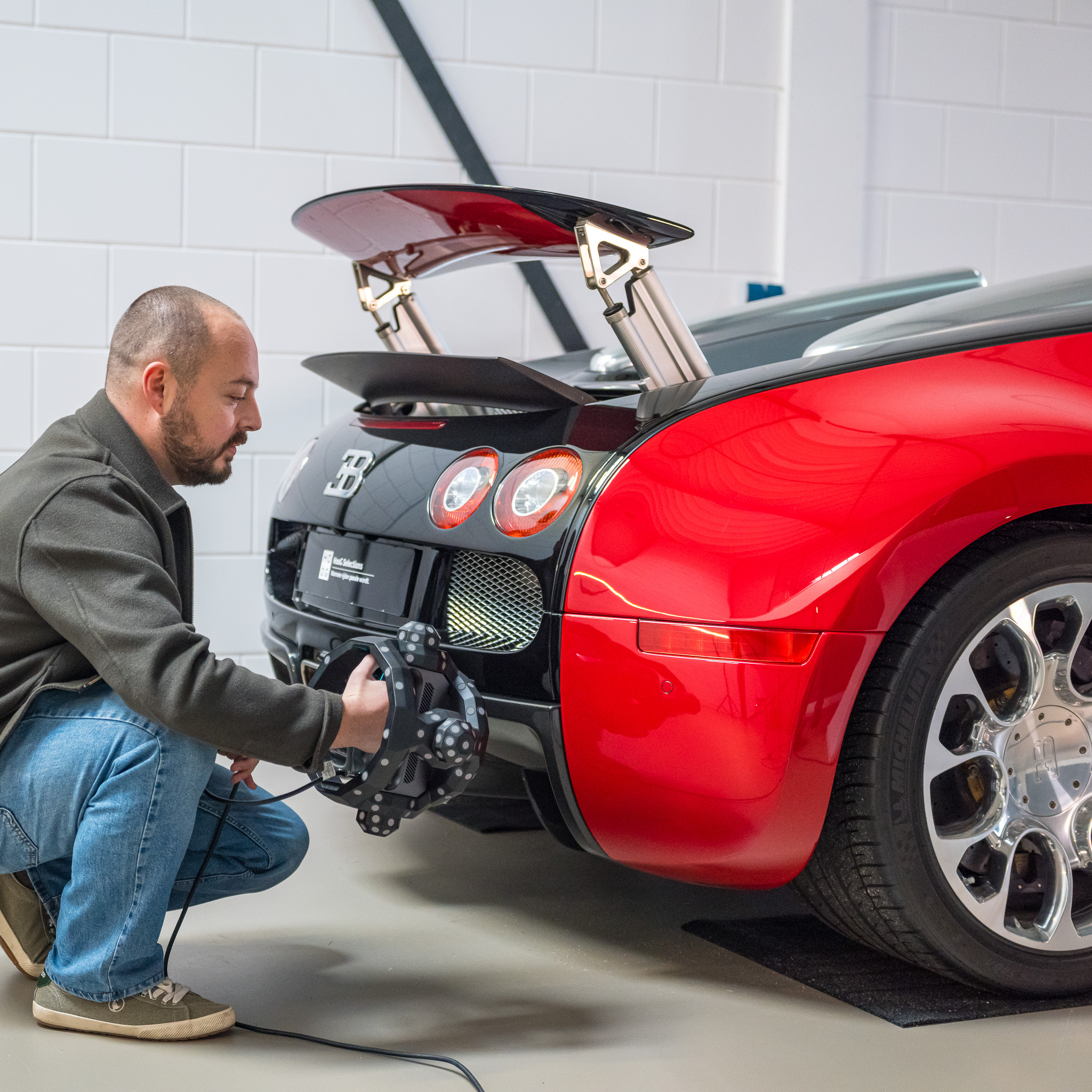 Scanning the rear of a Bugatti Veyron with a handheld scanner