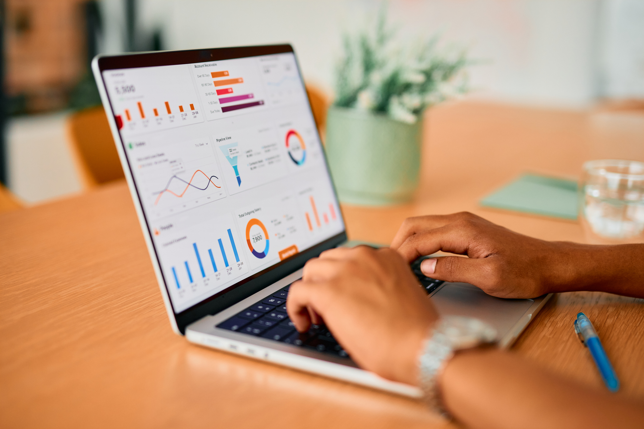Senior living sales professional analyzing key metrics and occupancy data on a sales dashboard to drive strategic growth