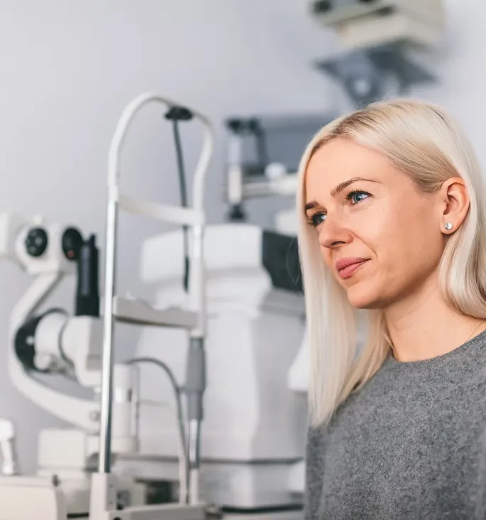 Woman sitting at the opticians office speaking about her results