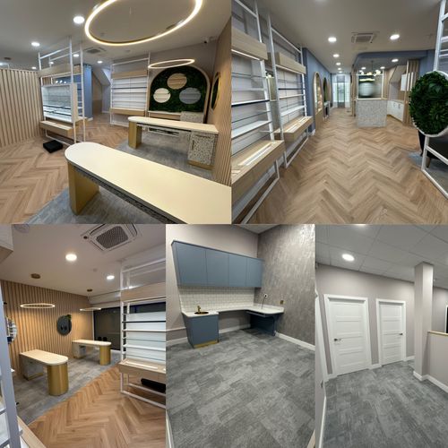 Modern interior design with wood floors, white shelves, and gold accents