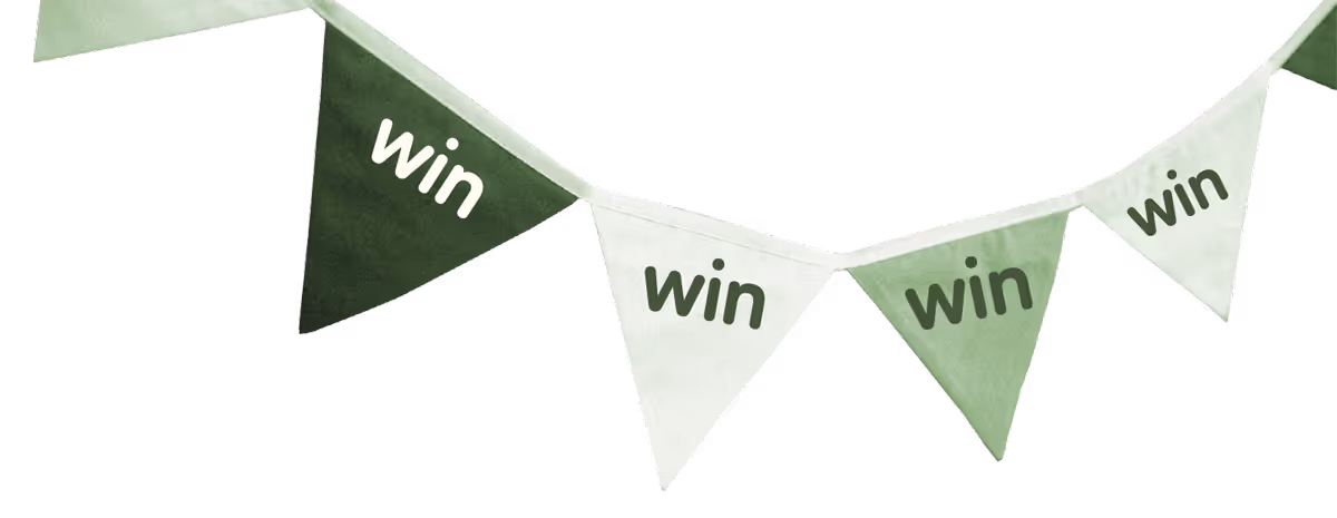 Green and white triangular pennant flags with the word 'win' written on each flag.