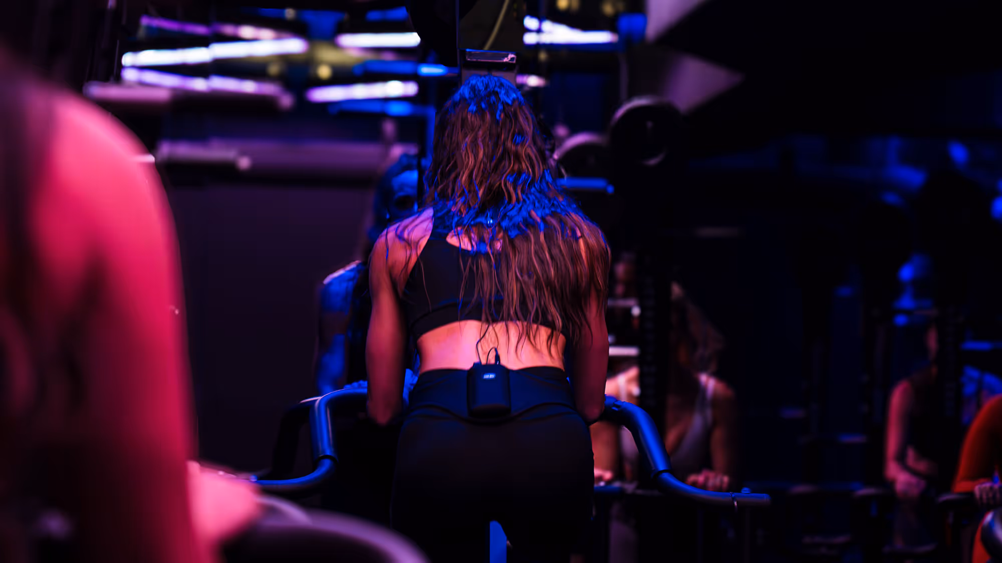 Woman with long hair wearing workout clothes on the Versaclimber