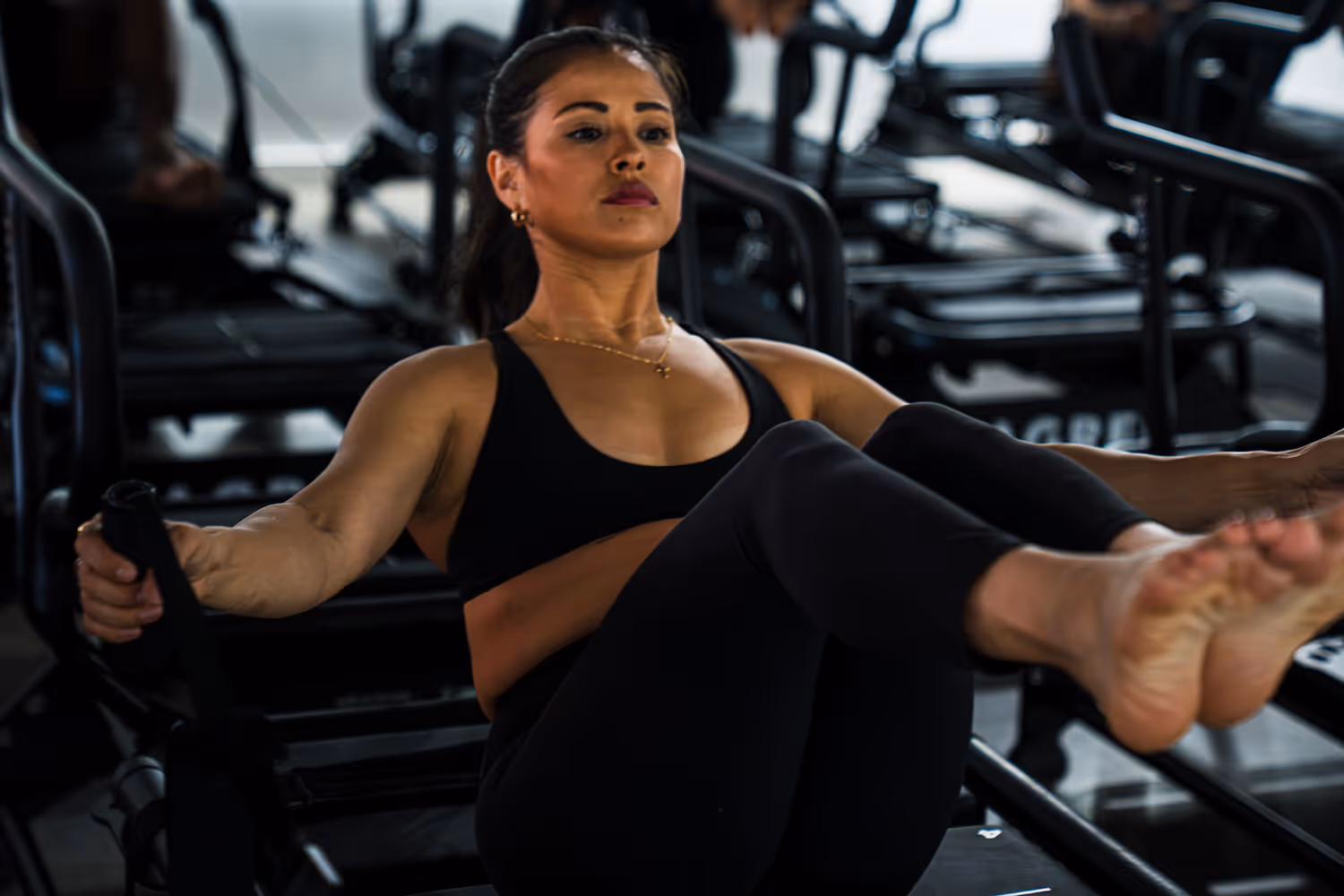 A women on a Lagree Megaformer machine