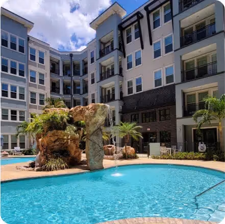 Resort-inspired pool with rock waterfall