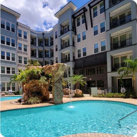 Resort-inspired pool with rock waterfall