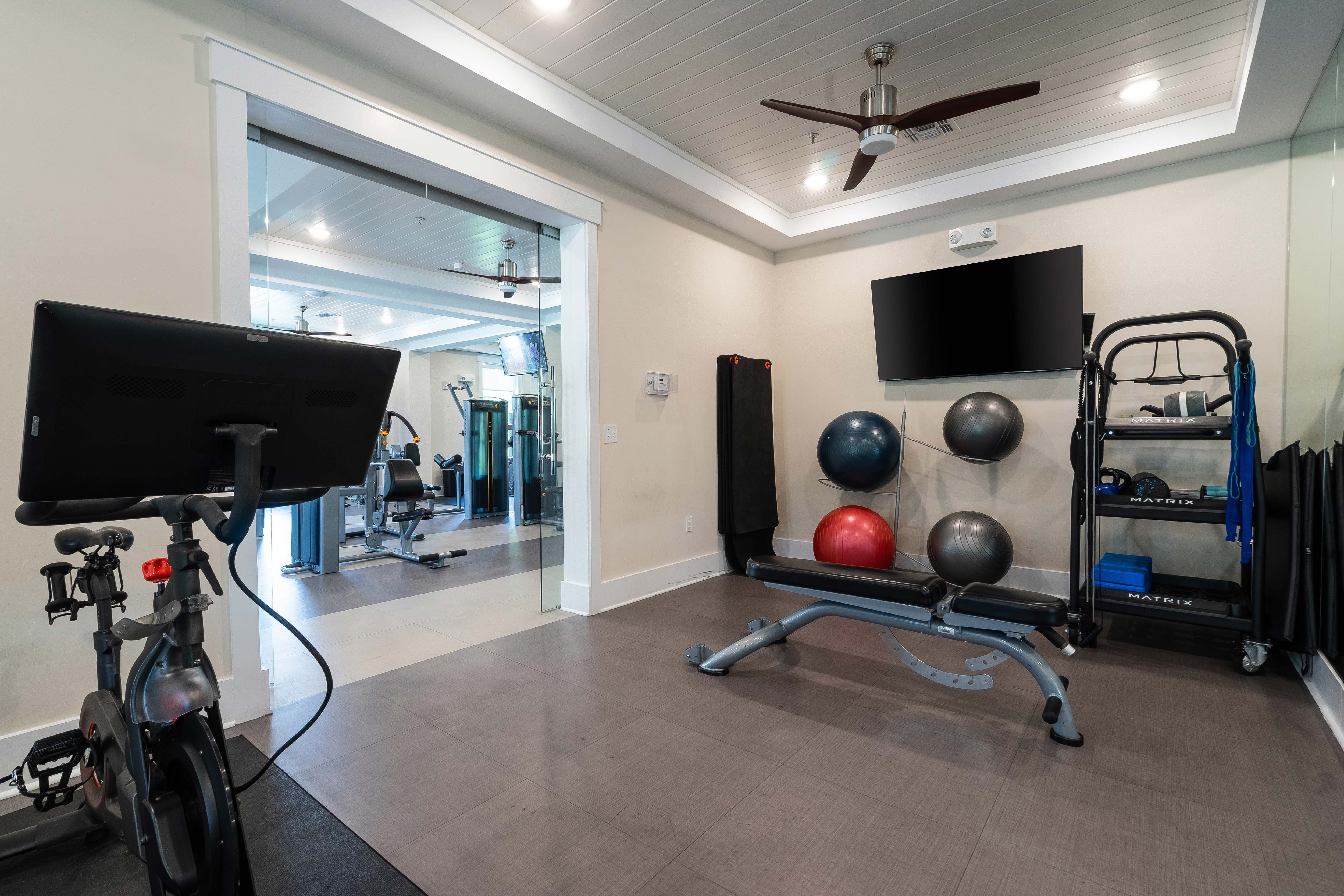 Fitness center with free weights and power rack at Novus Westshore
