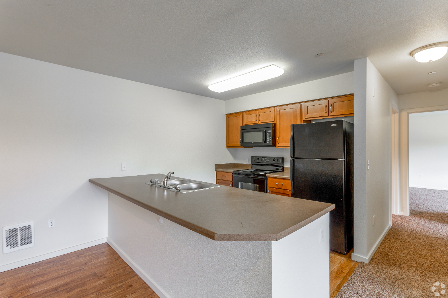 Copper Hill 2x2 Lilac Kitchen with black appliances