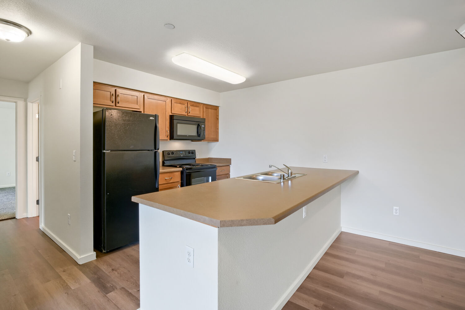 Copper Hill 2x2 Lilac Kitchen with black appliances