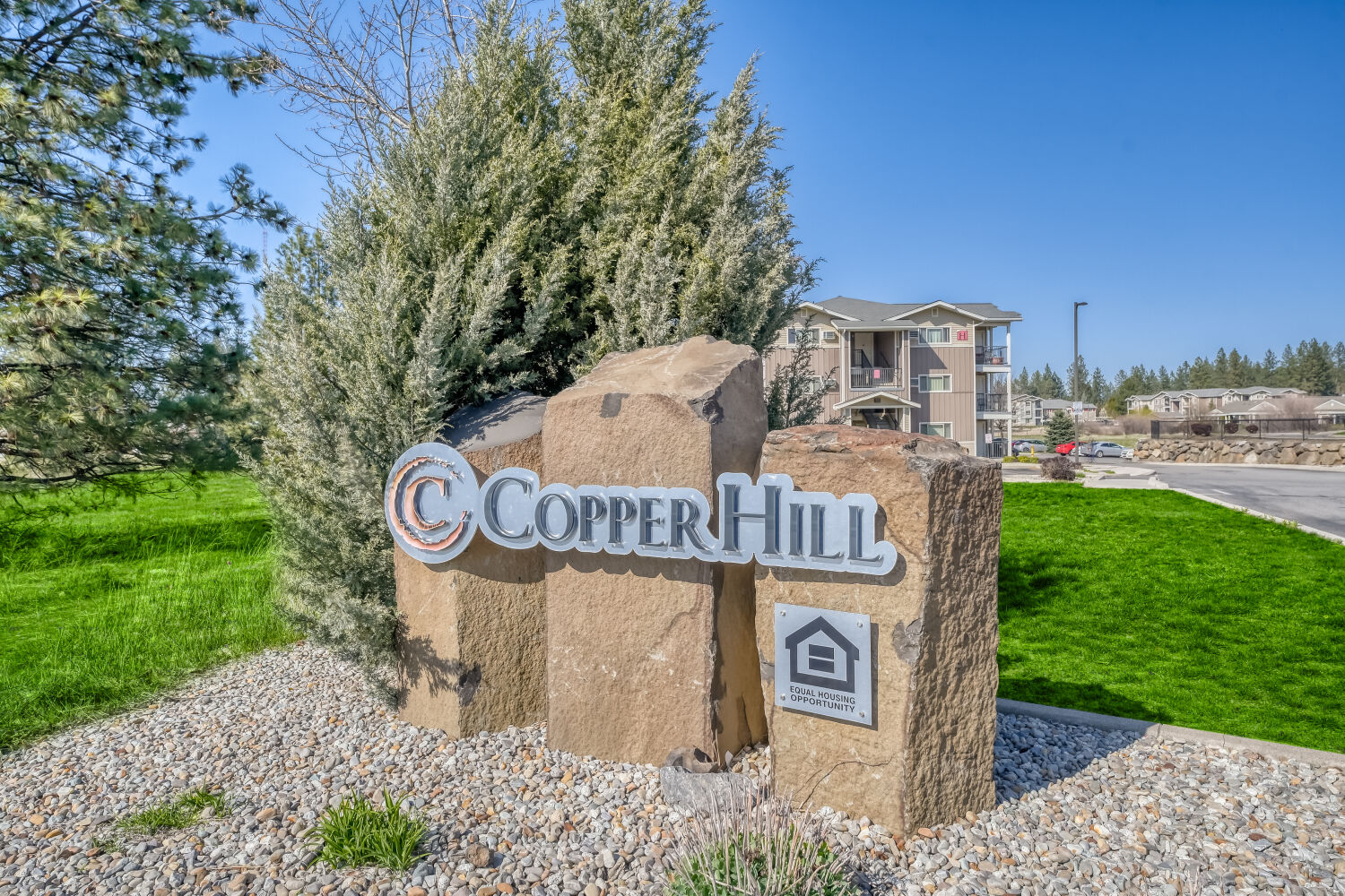 Entrance monument sign at Copper Hill affordable apartments in Spokane Valley, Washington